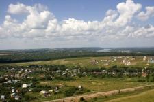 Нижегородка оштрафована за асфальт и лопухи на плодородной земле 